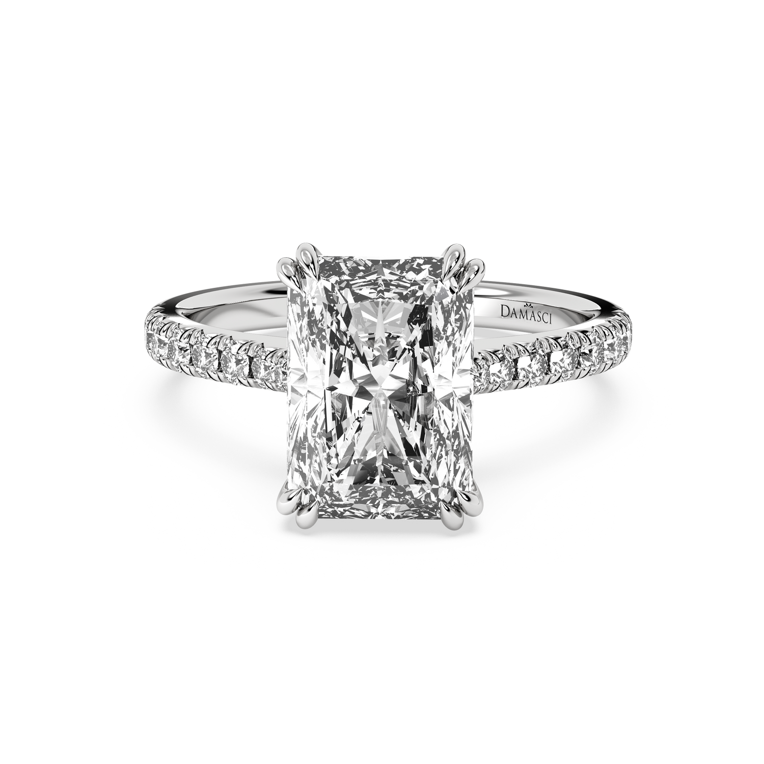 An emerald-cut diamond engagement ring with a diamond-accented band, shown on a clean white background. The brand name &